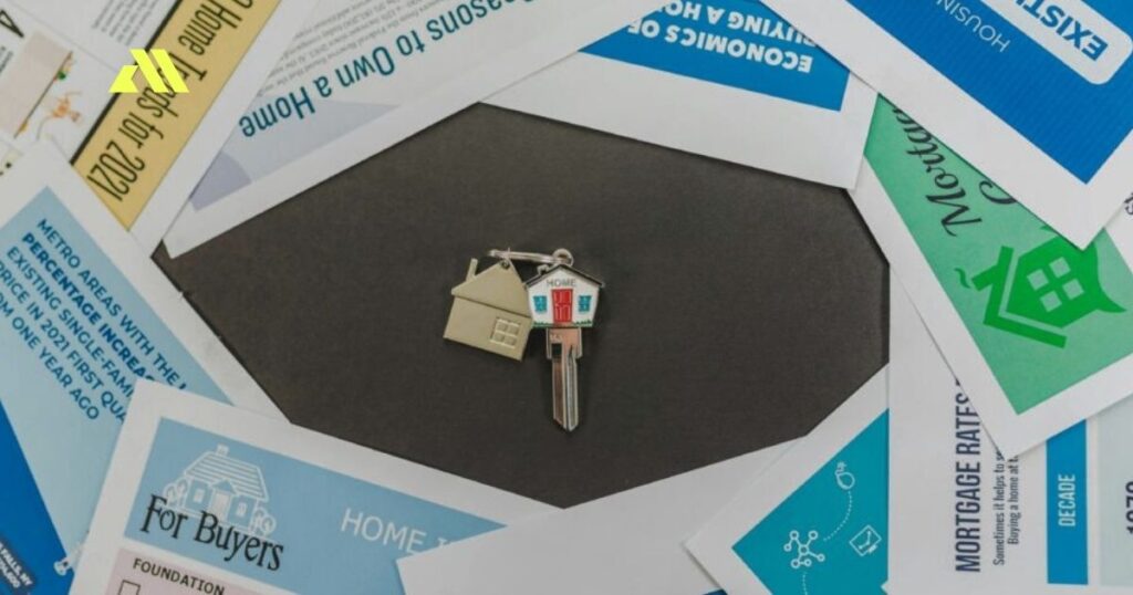 Keys surrounded by mortgage documents.