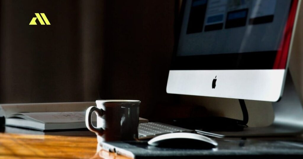 Desk with computer and coffee mug
