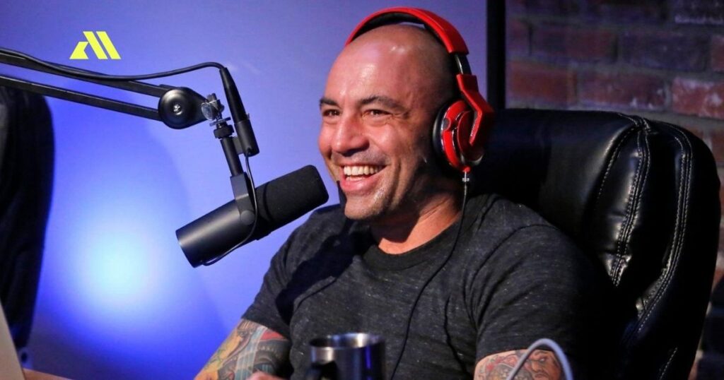 Man smiling with headphones and microphone